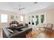 Bright living room featuring hardwood floors and French doors to the backyard at 1008 S Armenia Ave # A, Tampa, FL 33629