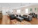 Open concept living room and kitchen area featuring stainless steel appliances, granite countertops and hardwood floors at 1008 S Armenia Ave # A, Tampa, FL 33629