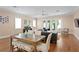 Bright living room with hardwood floors, dining area and sliding glass doors opening to the outdoors at 1008 S Armenia Ave # A, Tampa, FL 33629