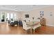 Bright living room featuring hardwood floors and French doors to the backyard at 1008 S Armenia Ave # A, Tampa, FL 33629