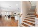 Open-concept living space featuring modern decor, staircase and ample natural light throughout at 1008 S Armenia Ave # A, Tampa, FL 33629