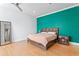 Spacious main bedroom with light wood floors and a large, colorful accent wall at 1008 S Armenia Ave # A, Tampa, FL 33629