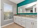 Bathroom with a large vanity with double sinks and a granite countertop at 10121 Westpark Preserve Blvd # 10121, Tampa, FL 33625