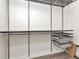 Walk-in closet provides ample storage with custom shelving and drawers at 10121 Westpark Preserve Blvd # 10121, Tampa, FL 33625