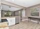Bright kitchen features white cabinets, stainless steel appliances, and granite countertops at 10121 Westpark Preserve Blvd # 10121, Tampa, FL 33625