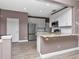 Beautiful kitchen with granite countertop, stainless steel appliances, and white cabinetry at 10121 Westpark Preserve Blvd # 10121, Tampa, FL 33625