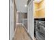 Hallway Laundry room with stainless steel washer and dryer and white wire shelving at 10121 Westpark Preserve Blvd # 10121, Tampa, FL 33625