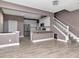 Open-concept living area with a view of the kitchen, featuring white cabinetry and a breakfast bar at 10121 Westpark Preserve Blvd # 10121, Tampa, FL 33625