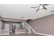 Open-concept living space featuring wood-look floors, a staircase, and a view of the kitchen at 10121 Westpark Preserve Blvd # 10121, Tampa, FL 33625