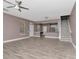 Spacious living room with a ceiling fan, recessed lighting, and wood flooring at 10121 Westpark Preserve Blvd # 10121, Tampa, FL 33625