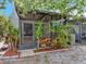 Screened patio surrounded by tropical plants and landscaping, creating a private outdoor space at 10121 Westpark Preserve Blvd # 10121, Tampa, FL 33625