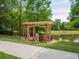 Outdoor pergola with seating and view of pond, perfect for relaxation at 10121 Westpark Preserve Blvd # 10121, Tampa, FL 33625