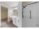 Bathroom featuring a sleek glass shower, vanity with ample counter space, and modern lighting at 1016 Mcdaniel St, Sun City Center, FL 33573