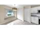 Bright dining area with white cabinetry, stainless steel appliances, and a window seat at 1016 Mcdaniel St, Sun City Center, FL 33573