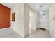 Inviting entryway with tile flooring and an adjacent room with a carpeted floor at 1016 Mcdaniel St, Sun City Center, FL 33573