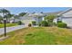 Well-manicured lawn and landscaping accentuates this inviting single-story home's charm and curb appeal at 1016 Mcdaniel St, Sun City Center, FL 33573