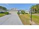 Charming single-story home with well-maintained landscaping and a spacious two-car garage at 1016 Mcdaniel St, Sun City Center, FL 33573