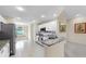 Modern kitchen featuring stainless steel appliances, white cabinets, and a breakfast bar at 1016 Mcdaniel St, Sun City Center, FL 33573