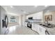 Stylish kitchen with granite countertops, stainless steel appliances, and breakfast bar at 1016 Mcdaniel St, Sun City Center, FL 33573