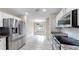 Well-lit kitchen with stainless steel appliances and an adjacent dining area with lots of natural light at 1016 Mcdaniel St, Sun City Center, FL 33573