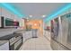 Bright kitchen features stainless appliances, granite counters, and recessed lighting at 1016 Mcdaniel St, Sun City Center, FL 33573