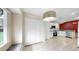Bright kitchen with white cabinets, stainless steel appliances, and granite countertops at 1016 Mcdaniel St, Sun City Center, FL 33573