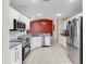 This kitchen features stainless steel appliances and a breakfast bar at 1016 Mcdaniel St, Sun City Center, FL 33573