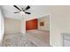 Bright living space with tiled entry and neutral carpet, open to a living room with an accent wall at 1016 Mcdaniel St, Sun City Center, FL 33573