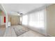 Bright living room with tile flooring, neutral walls, fan, and decorative rug at 1016 Mcdaniel St, Sun City Center, FL 33573