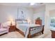 Cozy bedroom with a ceiling fan, art, and a large window for great light at 10321 Shady Oak Ln, Seminole, FL 33777