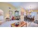 Spacious living room with a combination of seating and dining areas, great for entertaining guests at 10321 Shady Oak Ln, Seminole, FL 33777