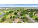 Stunning community aerial view with beautiful homes, mature trees, and waterway access at 10614 Low Oak Terrace, Thonotosassa, FL 33592