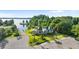 Aerial view of a charming home on a waterfront lot with private boat dock and parking at 10614 Low Oak Terrace, Thonotosassa, FL 33592