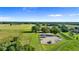 An aerial view showcases a fenced area with RV parking and boat storage at 10614 Low Oak Terrace, Thonotosassa, FL 33592