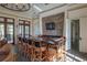 Indoor bar area features a stone accent wall, TV, granite counters, and seating for eight at 10614 Low Oak Terrace, Thonotosassa, FL 33592