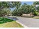 Welcoming entrance to StoneLake community featuring attractive signage and lush landscaping at 10614 Low Oak Terrace, Thonotosassa, FL 33592