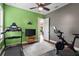 A private exercise room featuring exercise equipment and multiple entrances at 10614 Low Oak Terrace, Thonotosassa, FL 33592