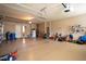 Oversized garage with ample space for storage and workbench at 10614 Low Oak Terrace, Thonotosassa, FL 33592