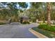 StoneLake community gatehouse with brick-paved entry and lush green landscaping at 10614 Low Oak Terrace, Thonotosassa, FL 33592