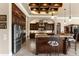 Luxurious kitchen with stainless steel appliances, a kitchen island, and custom cabinetry at 10614 Low Oak Terrace, Thonotosassa, FL 33592