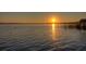 Scenic lake view at sunset, reflecting warm light on the tranquil water at 10614 Low Oak Terrace, Thonotosassa, FL 33592