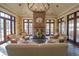 Cozy lobby area with a stone fireplace, comfortable seating, and large windows overlooking the grounds at 10614 Low Oak Terrace, Thonotosassa, FL 33592