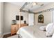 The primary bedroom features a decorative canopy bed frame and wood-look floors at 10614 Low Oak Terrace, Thonotosassa, FL 33592