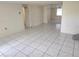 An expansive living room offers neutral paint, tile floors and natural light, awaiting personalized touches at 1155 Royalwood Dr, Holiday, FL 34690