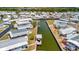 Wide aerial shot of the neighborhood highlighting canal access, docks, and a waterway at 119 E Saint Johns Way, Apollo Beach, FL 33572