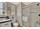 The bathroom features black and white wallpaper, neutral flooring, storage cabinet and a large mirror over the sink at 119 E Saint Johns Way, Apollo Beach, FL 33572