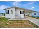 Cozy one-story house offering a carport and a welcoming front entrance at 119 E Saint Johns Way, Apollo Beach, FL 33572