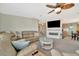 An inviting living room features a spacious seating area, fireplace, and open view into the kitchen at 119 E Saint Johns Way, Apollo Beach, FL 33572