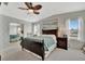 The primary bedroom features a leafy ceiling fan, large picture window and ample storage with closet at 119 E Saint Johns Way, Apollo Beach, FL 33572