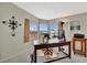 Bright home office space featuring a wooden desk with large windows at 119 E Saint Johns Way, Apollo Beach, FL 33572